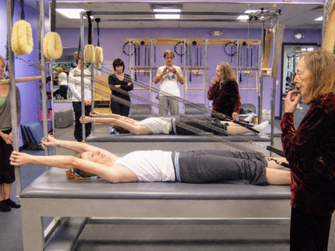 Jamie Trout training in a Pilates studio as Romana Kryzanowska observes