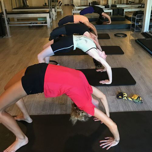Students practicing arching exercises